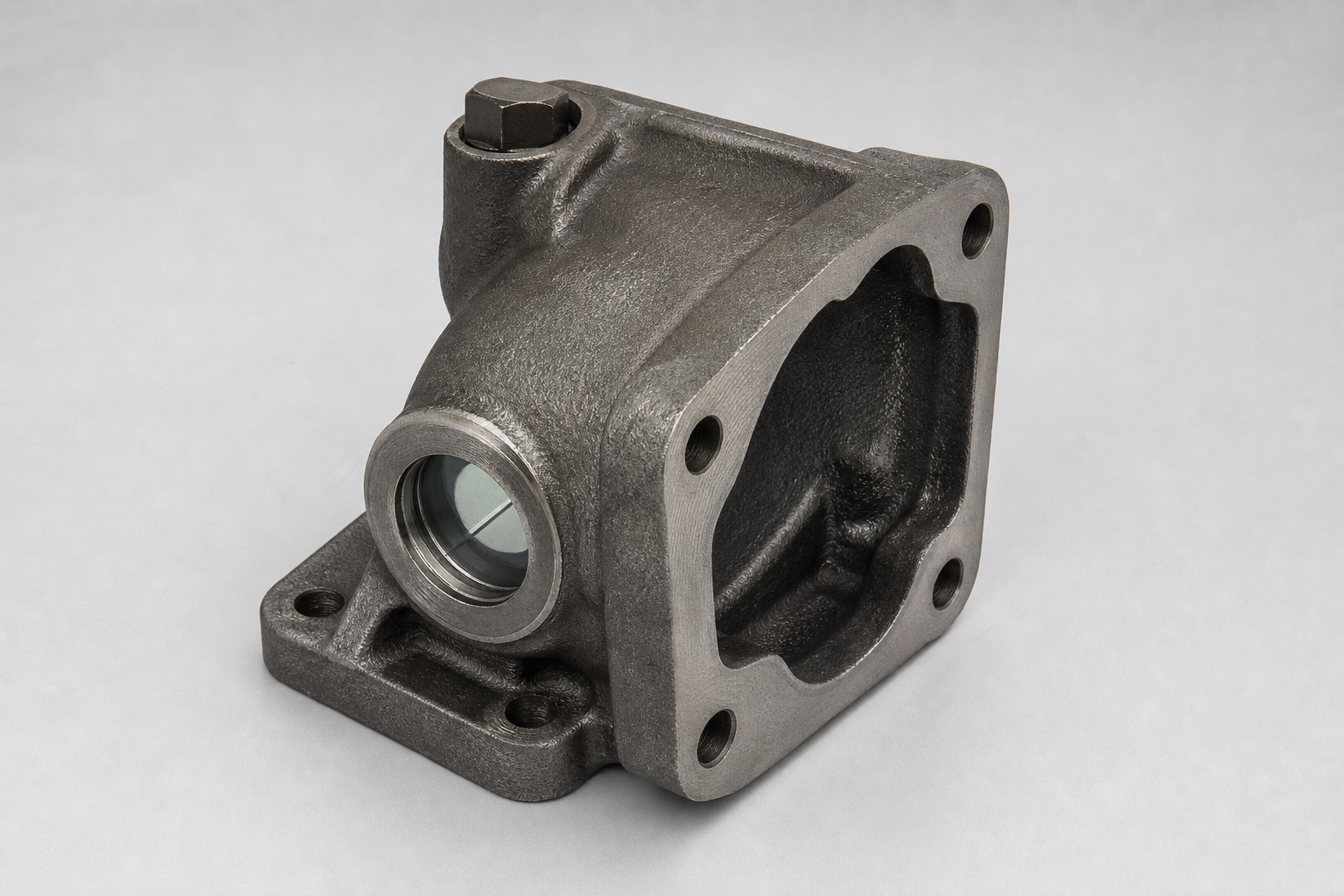 Oil level housing — illustrative cast and machined component